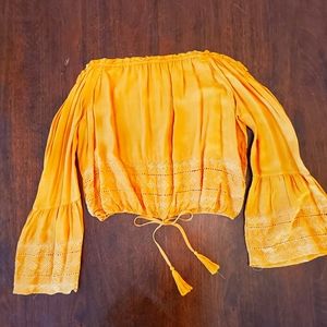 Off the shoulder crop top.  Bell sleeves